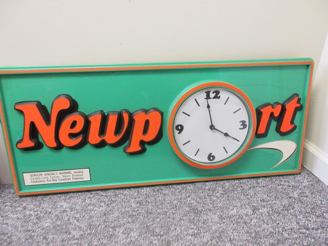 Newport Sign With Clock