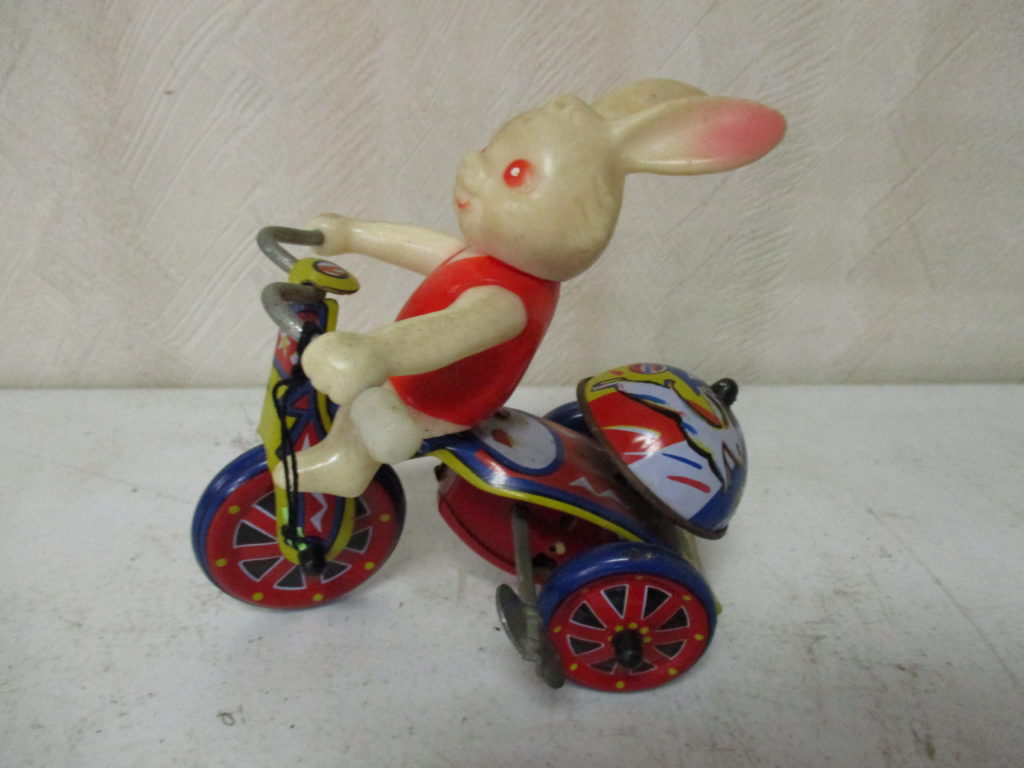 Lot 209: Wind-up Rabbit Riding Tricycle Toy