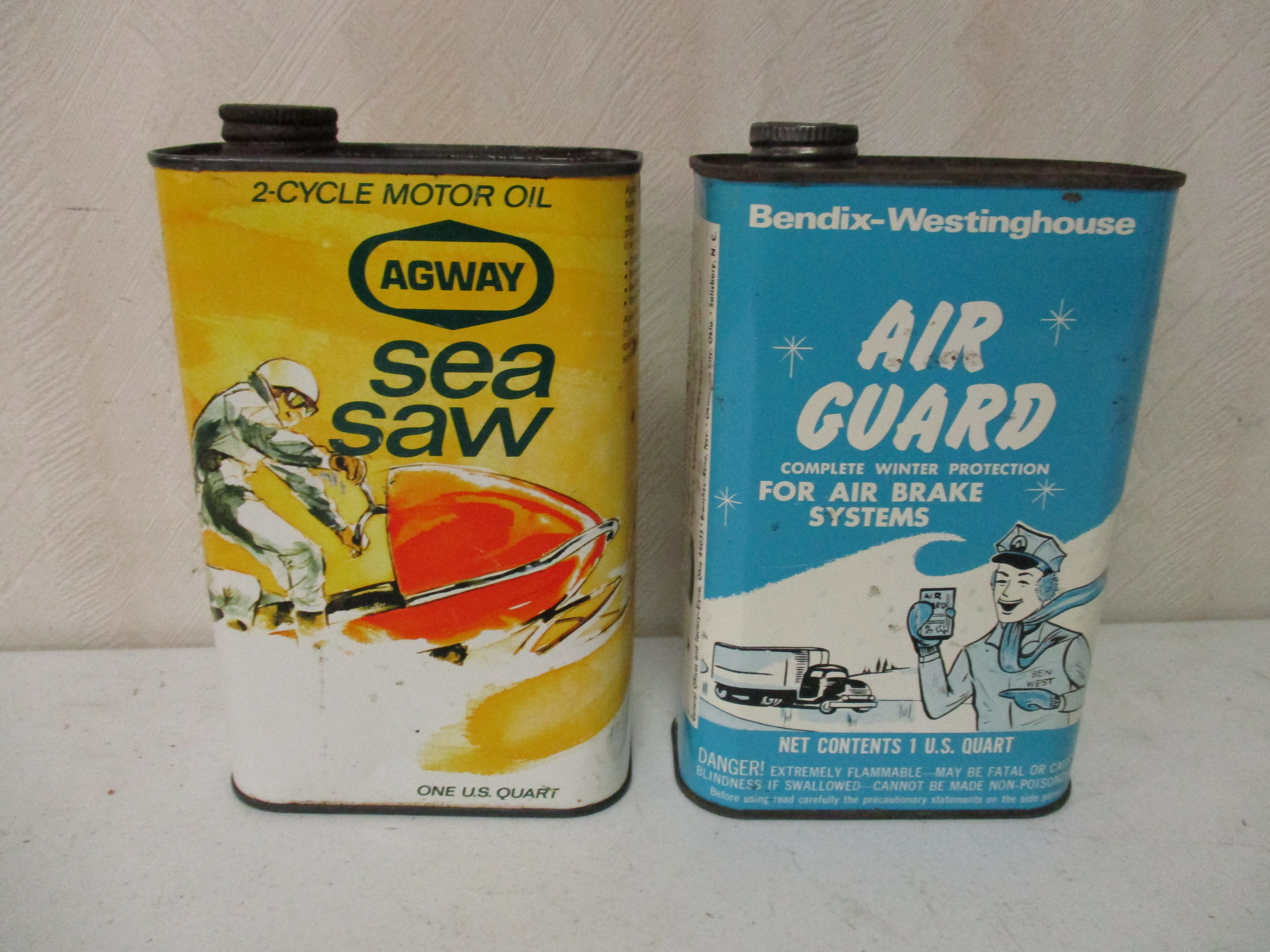 Lot 98: Air Guard And Sea Saw Quart Cans